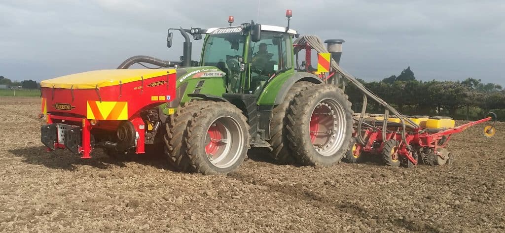 A beet planter machine working in a field